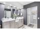 Bathroom showcasing double sinks, modern vanities, and a glass-enclosed shower at 2222 Lucerne Ct, Henderson, NV 89014