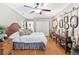 Bedroom featuring a comfortable bed with decorative pillows and mirrors on the wall at 2222 Lucerne Ct, Henderson, NV 89014