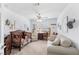 Inviting bedroom with neutral paint, ceiling fan, and comfortable seating at 2222 Lucerne Ct, Henderson, NV 89014