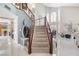 Two-story foyer featuring a staircase, with a chandelier, a high ceiling, and neutral flooring at 2222 Lucerne Ct, Henderson, NV 89014