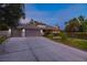 Lovely single-story home with a three-car garage and well-maintained lawn at 2222 Lucerne Ct, Henderson, NV 89014