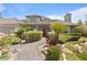 Charming single-story home with beautifully landscaped front yard and inviting brick walkway at 2222 Lucerne Ct, Henderson, NV 89014