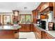 Modern kitchen features wood cabinets, granite countertops, stainless steel appliances, and a view to the backyard at 2222 Lucerne Ct, Henderson, NV 89014