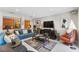 Cozy living room features comfortable seating, TV, stylish decor, and a colorful accent wall for added character at 2222 Lucerne Ct, Henderson, NV 89014