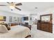 Spacious main bedroom with neutral carpet, a ceiling fan, and ample natural light at 2222 Lucerne Ct, Henderson, NV 89014