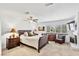 Spacious main bedroom with neutral carpet, a ceiling fan, and ample natural light at 2222 Lucerne Ct, Henderson, NV 89014