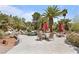 Backyard pool with outdoor seating and lush greenery at 2222 Lucerne Ct, Henderson, NV 89014