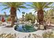 Backyard pool with mature landscaping and slide feature at 2222 Lucerne Ct, Henderson, NV 89014