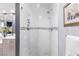 Modern shower with white tile, niche shelving, and glass door at 2222 Lucerne Ct, Henderson, NV 89014