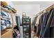 Organized walk-in closet with shelving, hanging rods, and a display case at 2222 Lucerne Ct, Henderson, NV 89014