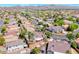 Wide aerial shot showcasing a residential neighborhood with mountain views and well-maintained properties at 2544 Ashley Rose Ter, Henderson, NV 89052