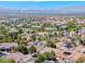 Expansive aerial view of a suburban community, highlighting the neighborhood's layout and city skyline at 2544 Ashley Rose Ter, Henderson, NV 89052