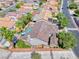Stunning aerial view of a home with a backyard pool, lush landscaping, and a charming patio area at 2544 Ashley Rose Ter, Henderson, NV 89052