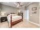 Comfortable bedroom with a ceiling fan, a wooden bed frame, and light-colored wood flooring at 2544 Ashley Rose Ter, Henderson, NV 89052