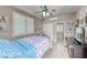 A comfortable bedroom features a ceiling fan and plantation shutters to provide ample light and ventilation at 2544 Ashley Rose Ter, Henderson, NV 89052