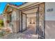 Home entrance featuring an ornate security gate and stamped concrete pathway at 2544 Ashley Rose Ter, Henderson, NV 89052
