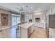 Beautiful kitchen boasts an island, stainless appliances, and backyard views at 2544 Ashley Rose Ter, Henderson, NV 89052