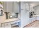 This kitchen shows lots of cabinet storage and a built-in desk for the home at 2544 Ashley Rose Ter, Henderson, NV 89052