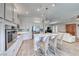 Bright, open kitchen with lots of storage, stainless appliances, and a large island with seating at 2544 Ashley Rose Ter, Henderson, NV 89052