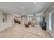 Expansive living room with wood floors, ceiling fan, and multiple seating areas at 2544 Ashley Rose Ter, Henderson, NV 89052