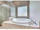 Elegant main bathroom with a glass shower enclosure and separate soaking tub at 2544 Ashley Rose Ter, Henderson, NV 89052