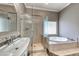 Elegant main bathroom with a glass shower enclosure and separate soaking tub at 2544 Ashley Rose Ter, Henderson, NV 89052