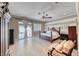 Bright main bedroom with hardwood floors, ceiling fan, and sliding doors to the outdoor pool area at 2544 Ashley Rose Ter, Henderson, NV 89052