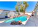 Stunning pool with rock accents, a small jacuzzi, and beautifully landscaped surroundings at 2544 Ashley Rose Ter, Henderson, NV 89052
