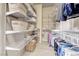 A fully outfitted walk-in closet offers storage for clothes and shoes at 2544 Ashley Rose Ter, Henderson, NV 89052
