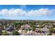 Expansive aerial view of a luxury home in a lush, green neighborhood with city views at 276 Glenridding St, Las Vegas, NV 89183