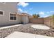 The private backyard features a rock landscape and a patio perfect for outdoor entertaining at 276 Glenridding St, Las Vegas, NV 89183