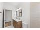 Bathroom featuring marble countertops and wood cabinetry at 276 Glenridding St, Las Vegas, NV 89183