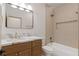 Bathroom featuring a tub-shower combination and warm-toned tiles at 276 Glenridding St, Las Vegas, NV 89183