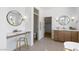 Open bathroom with dual vanities, makeup counter, and glass shower at 276 Glenridding St, Las Vegas, NV 89183