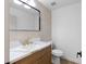 Powder room featuring a wood vanity with a marble countertop at 276 Glenridding St, Las Vegas, NV 89183