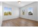 Bedroom featuring hardwood floors and large windows offering bright views at 276 Glenridding St, Las Vegas, NV 89183
