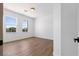 Bedroom with hardwood floors and two windows offering views of the surrounding scenery at 276 Glenridding St, Las Vegas, NV 89183
