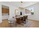 This dining room features a window, table, rug, light fixture and four chairs at 276 Glenridding St, Las Vegas, NV 89183