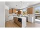 Well-lit kitchen with a center island, modern appliances, and sleek countertops at 276 Glenridding St, Las Vegas, NV 89183