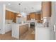 Modern kitchen with stainless steel appliances, white countertops, and wood cabinets at 276 Glenridding St, Las Vegas, NV 89183
