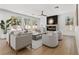 Bright living room with large windows, fireplace, and modern furniture at 276 Glenridding St, Las Vegas, NV 89183