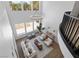 A modern living room with high ceilings, light hardwood floors, and a view of the balcony at 276 Glenridding St, Las Vegas, NV 89183