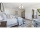 Comfortable main bedroom featuring a plush bed and seating area at 276 Glenridding St, Las Vegas, NV 89183