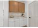 Charming mudroom featuring custom cabinets and a marble countertop at 276 Glenridding St, Las Vegas, NV 89183