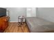 Bedroom with a large window providing natural light and hardwood floors at 3135 S Mojave Rd # 113, Las Vegas, NV 89121