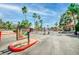 View of the gated community entrance with lush desert landscaping at 3135 S Mojave Rd # 113, Las Vegas, NV 89121