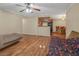 Open floor plan featuring hardwood floors and a kitchen/dining area beyond the living space at 3135 S Mojave Rd # 113, Las Vegas, NV 89121