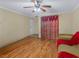 View of the living room with hardwood floors, fan and doorway leading to another room at 3135 S Mojave Rd # 113, Las Vegas, NV 89121