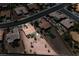 Aerial view of a desert home showcasing meticulous landscaping, nearby houses, and neighborhood streets at 3157 Faiss Dr, Las Vegas, NV 89134