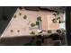Aerial view of the property showcasing its desert landscaping, tile roof, and patio area at 3157 Faiss Dr, Las Vegas, NV 89134